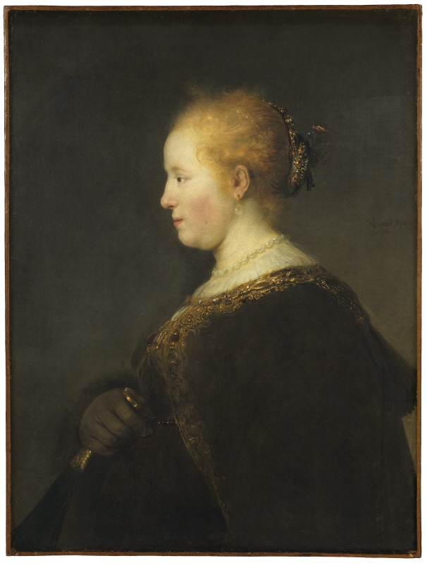 Ung kvinna i profil, med solfjäder