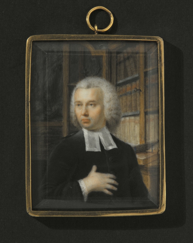 Unknown clergyman in a library setting