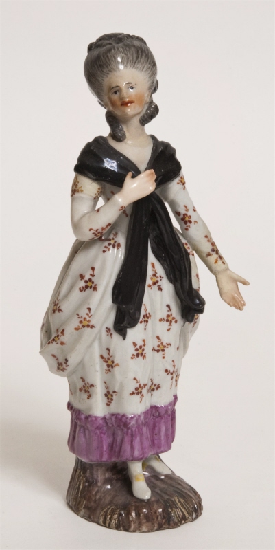 Figurin,  dam med korslagd sjal över bröstet