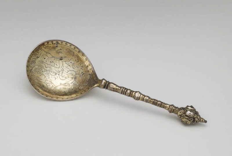 Spoon with engraving of Adam and Eve and the crucifixion in the bowl