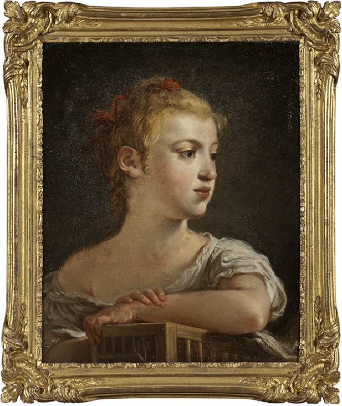 Porträtt av ung flicka med fågelbur