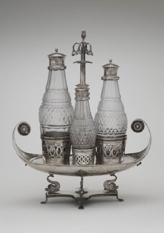Table surtout with boat-shaped stand and four glass bottles