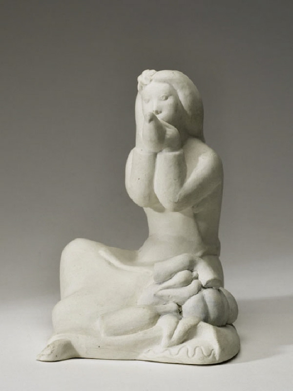 Figurin, sittande kvinna som blåser i lergök