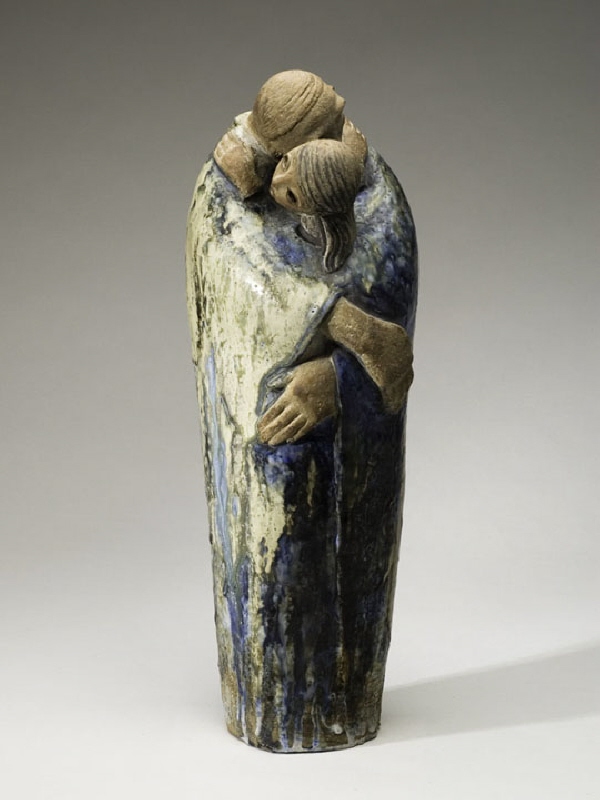 Skulptur, man och kvinna i omfamning