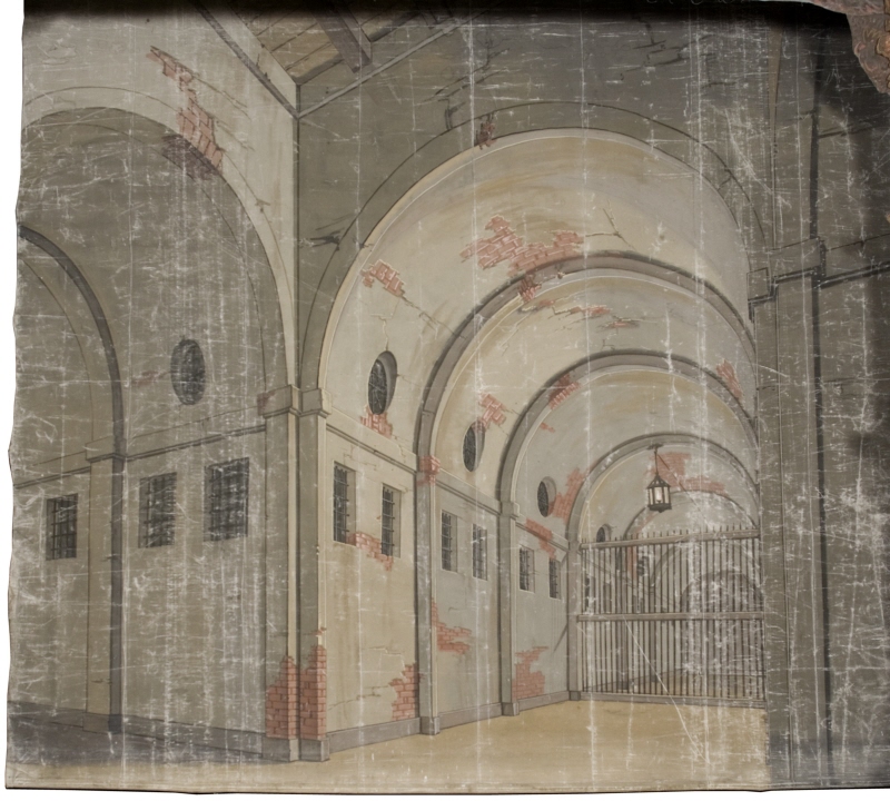 Del av kuliss till "Ett fängelse" 8 delar: Fondvägg, fängelseinteriör med murade valv och grind