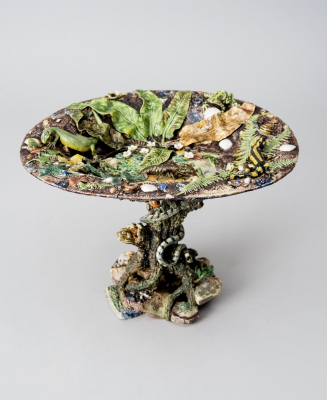 Tazza decorated with snakes and plants in relief