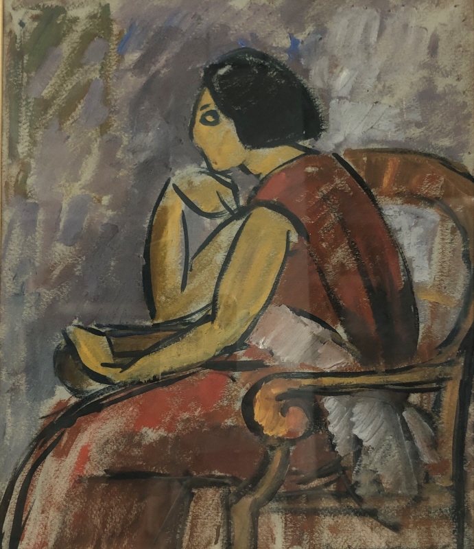 Kvinna sittande i en fåtölj