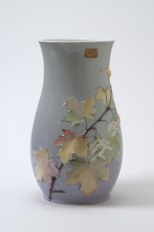 Vase with maple autumn leafs