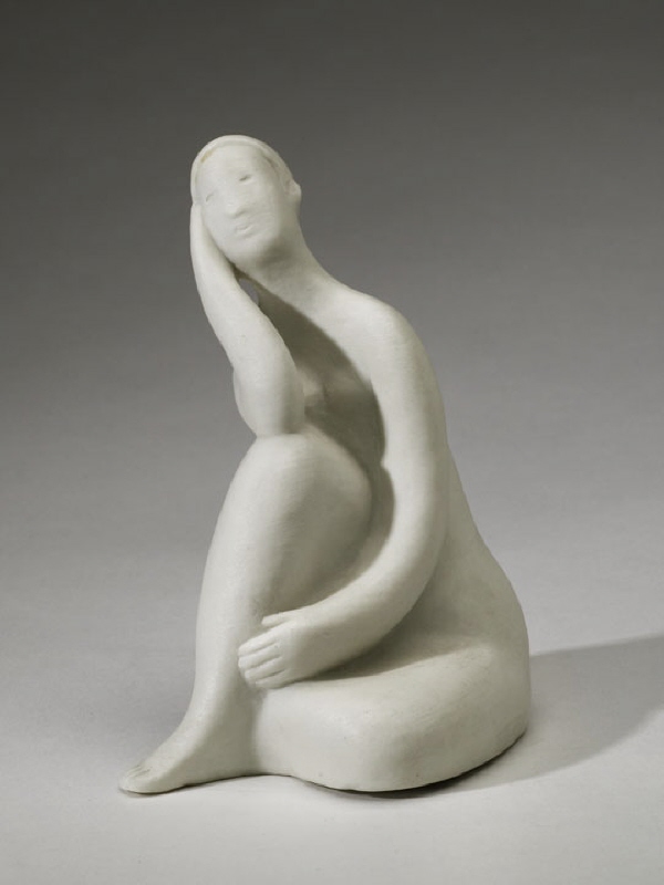 Figurin av sittande kvinna