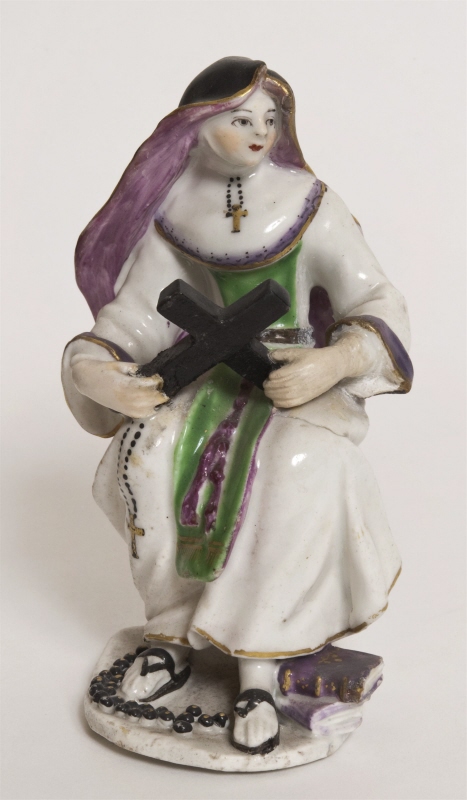 Figurin, sittande nunna på en pall