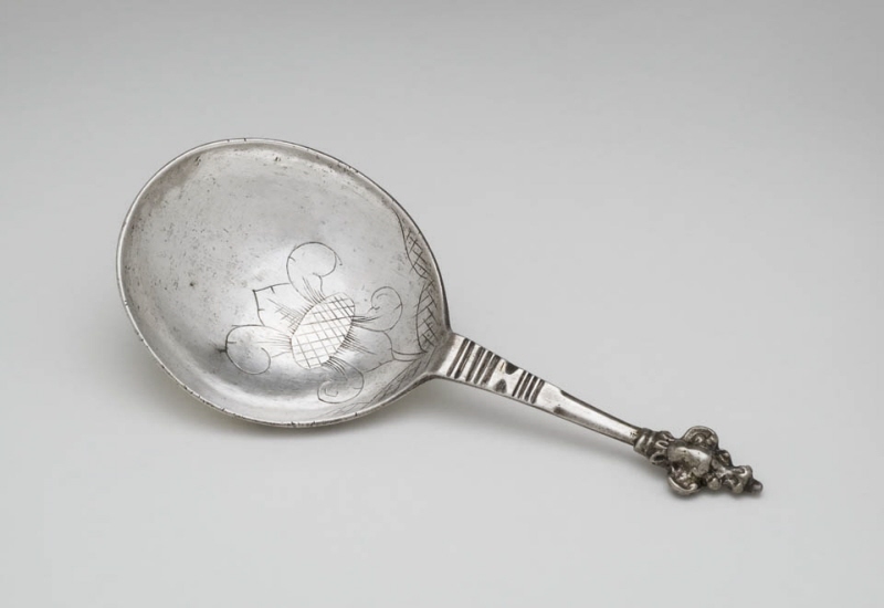 Spoon with an engraved lily in the bowl
