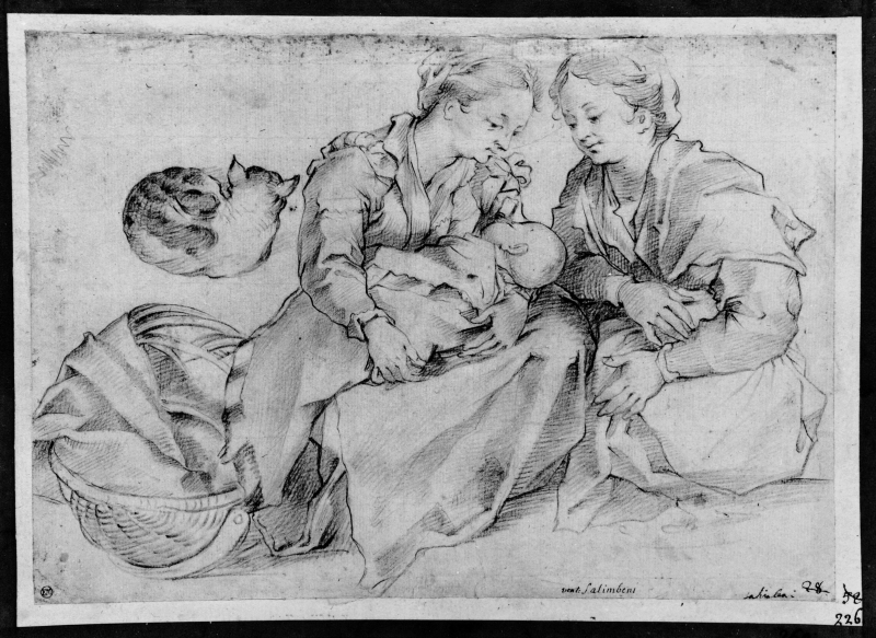 Two women seated together with a child