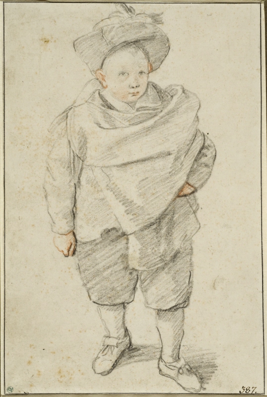 A small boy in a wide cape