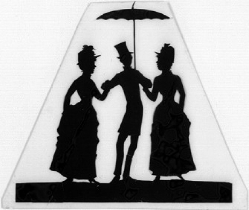 Herre med paraply mellan två damer