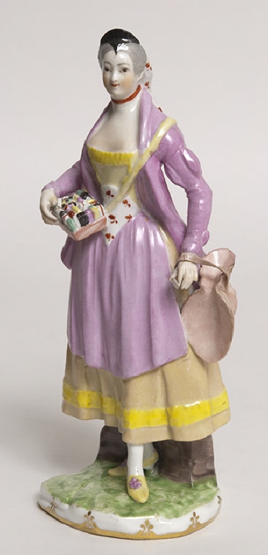Figurin, månglerska, med svart hårprydnad. Ingår i serien "Cris de Vienne"