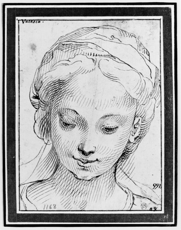 Head of young girl, eyes downcast