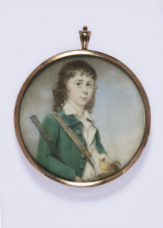 Portrait of a young boy, dressed as a hunter holding a gun and his dog