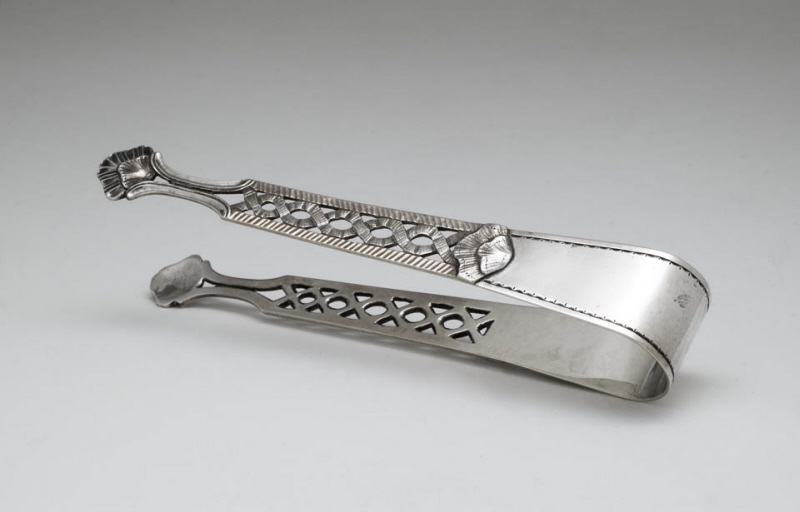 Sugar tongs decorated with openwork ribbon