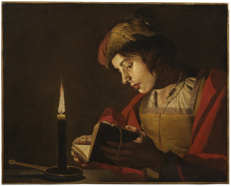 A Young Man Reading by Candlelight