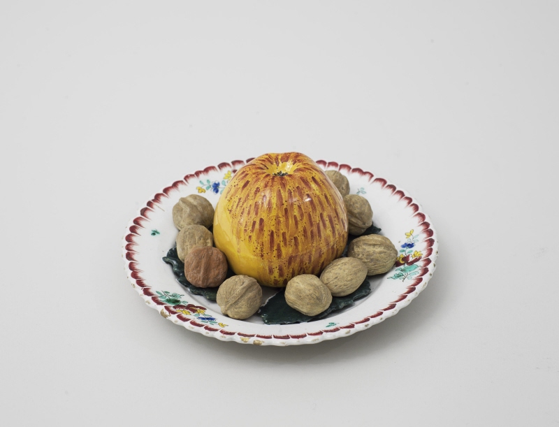 Plate with apple and walnuts