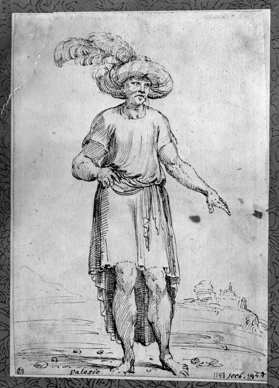 Stående orientalisk man som bär en plymförsedd turban